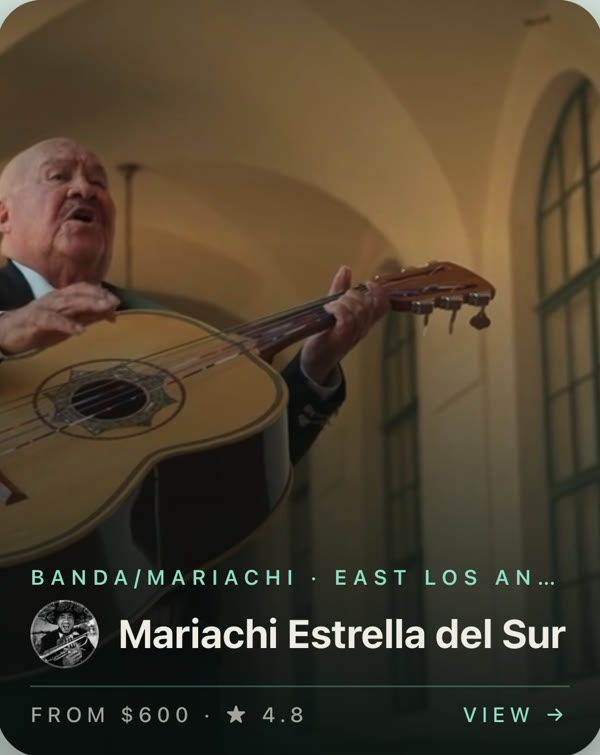A mariachi musician playing guitarrón